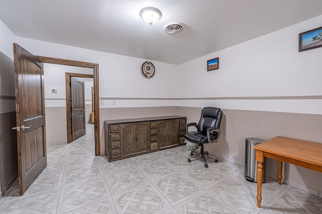 office with a textured ceiling