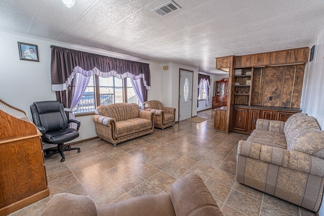 living room with a textured ceiling