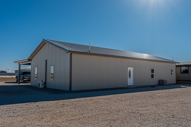 rear view of house with central AC