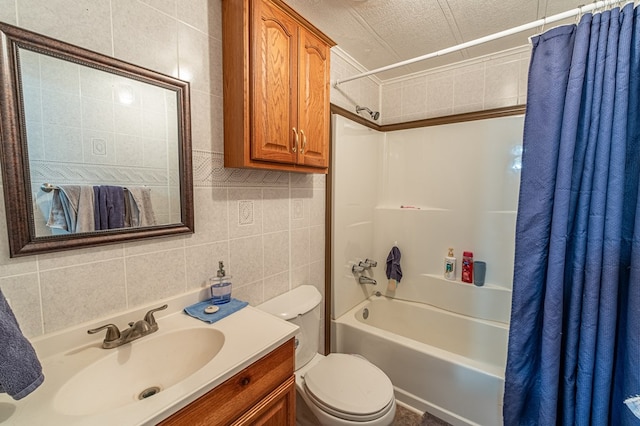 full bathroom featuring tasteful backsplash, tile walls, shower / bath combination with curtain, vanity, and toilet