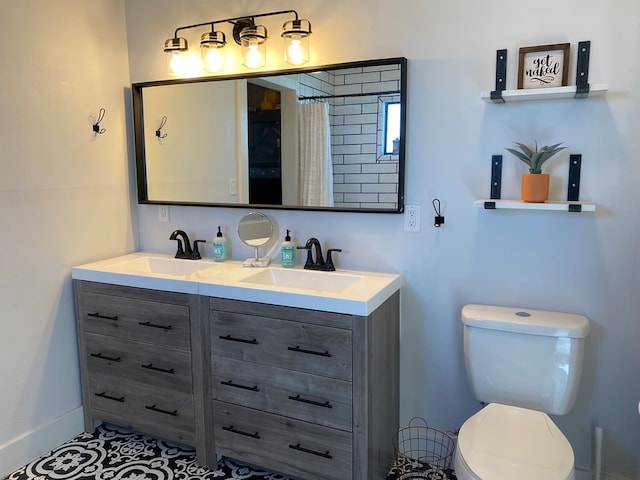 bathroom with curtained shower, tile patterned flooring, vanity, and toilet