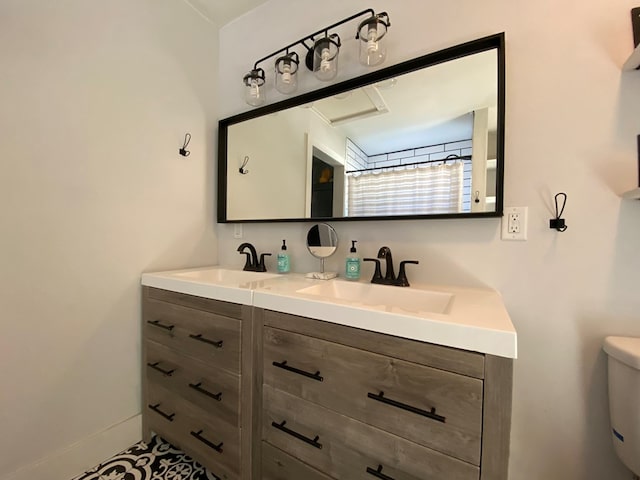 bathroom with vanity, toilet, and walk in shower