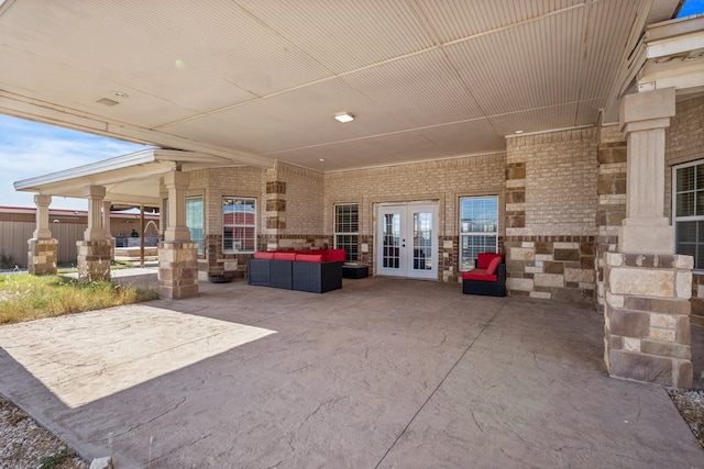 view of patio with an outdoor living space and french doors