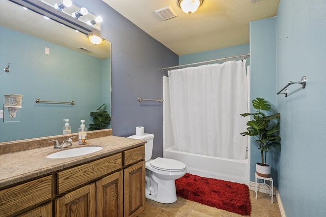 full bathroom with vanity, shower / bath combo, and toilet