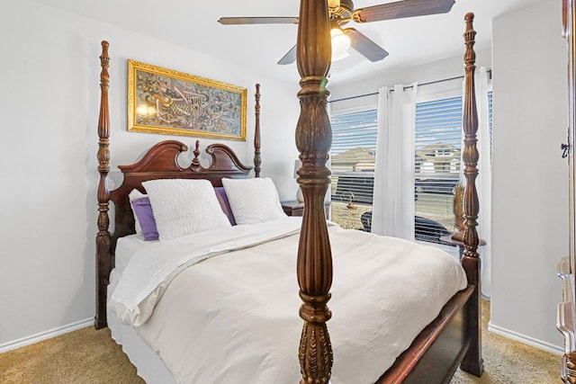 bedroom with ceiling fan and light carpet