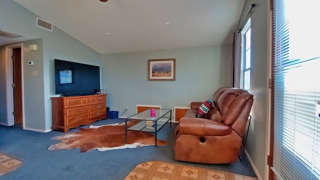 living area with carpet and lofted ceiling