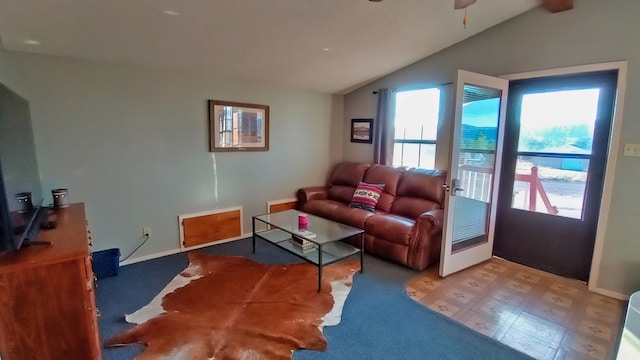 living room featuring vaulted ceiling