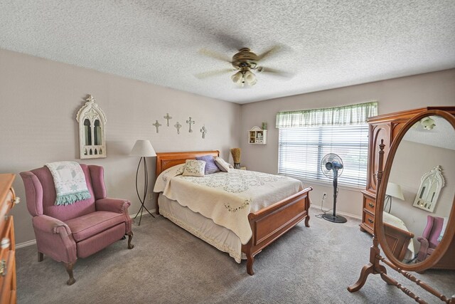 bedroom featuring carpet flooring, a ceiling fan, baseboards, and a textured ceiling