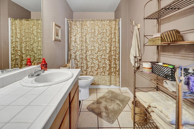 full bath featuring toilet, a textured ceiling, a shower with shower curtain, tile patterned flooring, and vanity