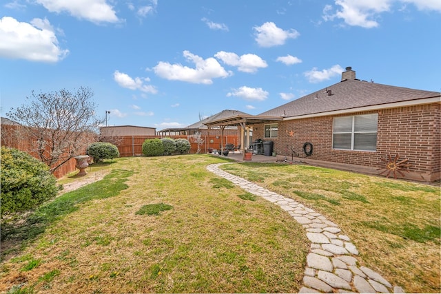 view of yard featuring a patio and a fenced backyard