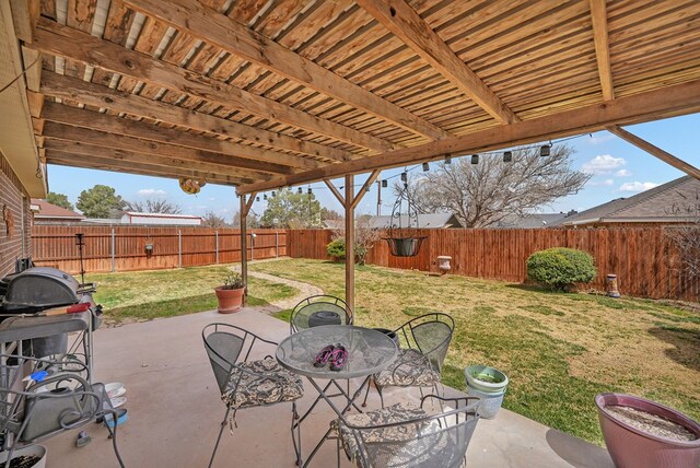 view of patio featuring grilling area, outdoor dining area, and a fenced backyard