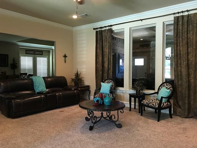 living room with crown molding and carpet floors