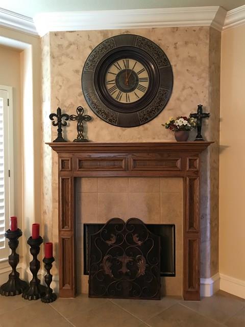 room details featuring ornamental molding and a tile fireplace