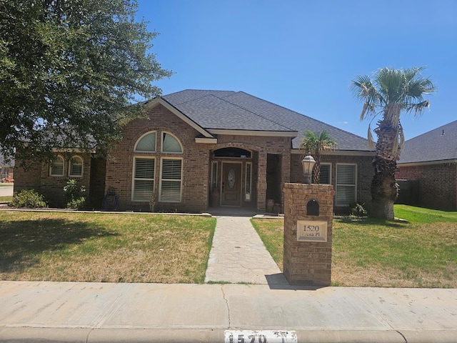 view of front of home with a front lawn