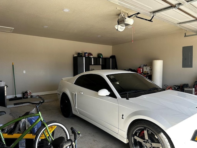 garage with electric panel and a garage door opener