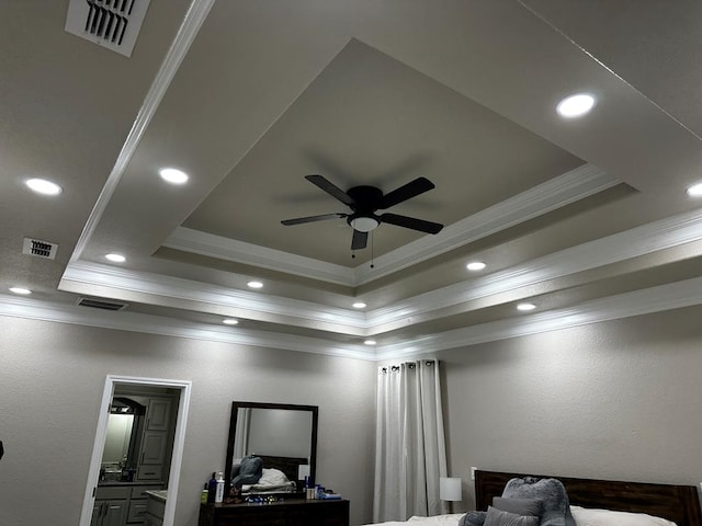 room details with ceiling fan, a raised ceiling, and crown molding