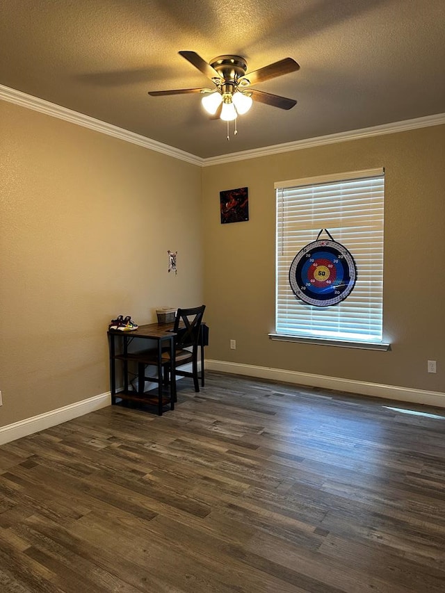 dining room featuring ceiling fan, dark hardwood / wood-style flooring, ornamental molding, and a textured ceiling