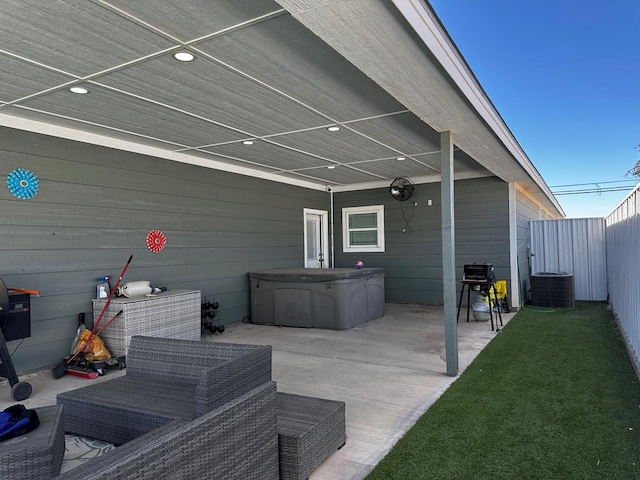 view of patio / terrace featuring central AC and a hot tub