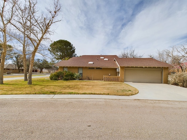 ranch-style home featuring a front lawn and a garage