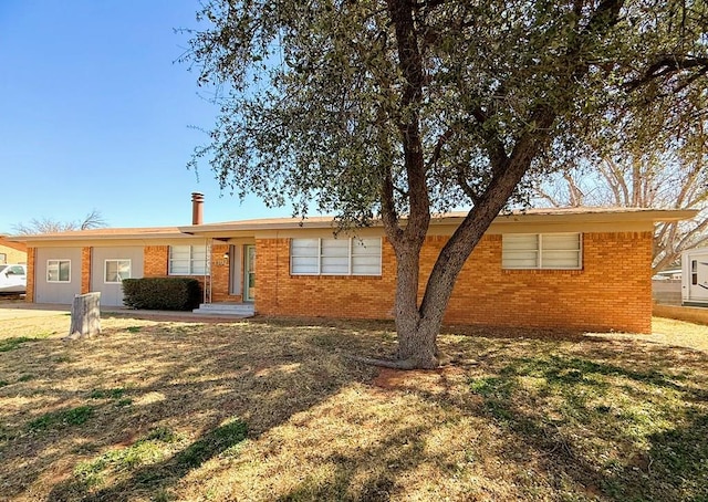 ranch-style house with brick siding