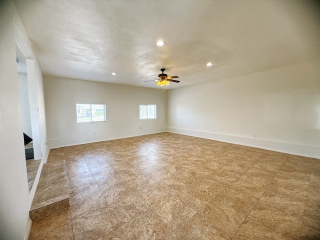 unfurnished room with recessed lighting, baseboards, and ceiling fan