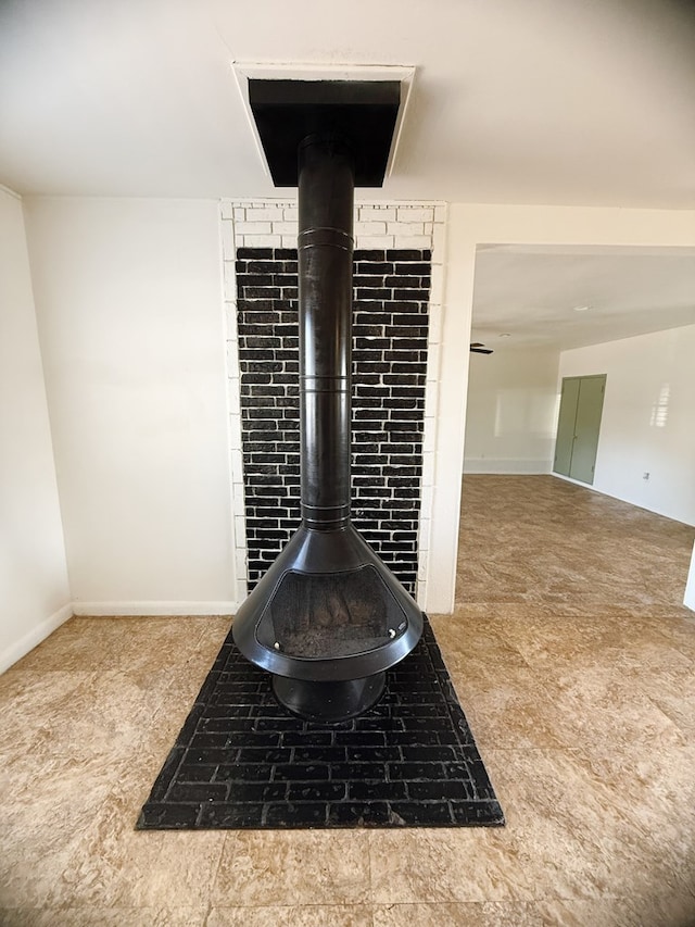 interior details featuring a wood stove