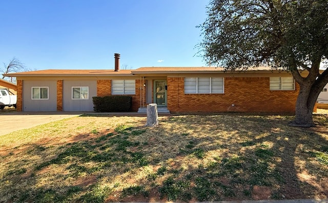 single story home featuring brick siding