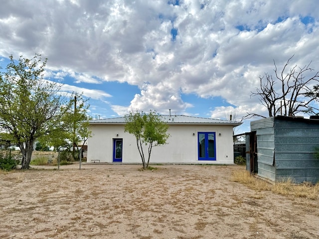 back of property featuring french doors