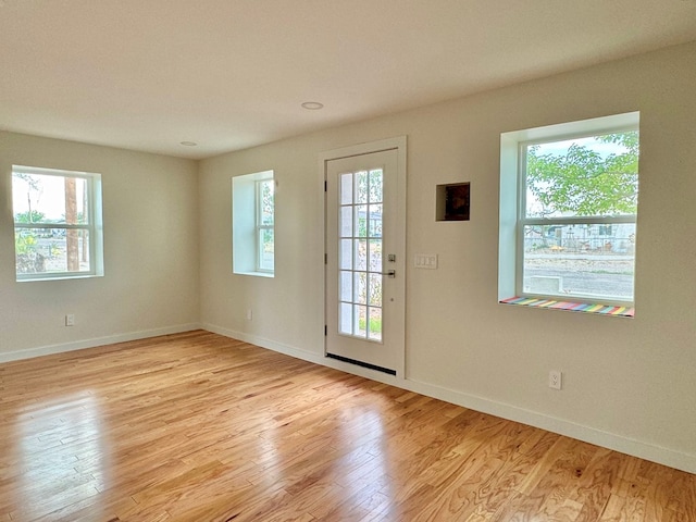 entryway featuring light hardwood / wood-style floors and a wealth of natural light