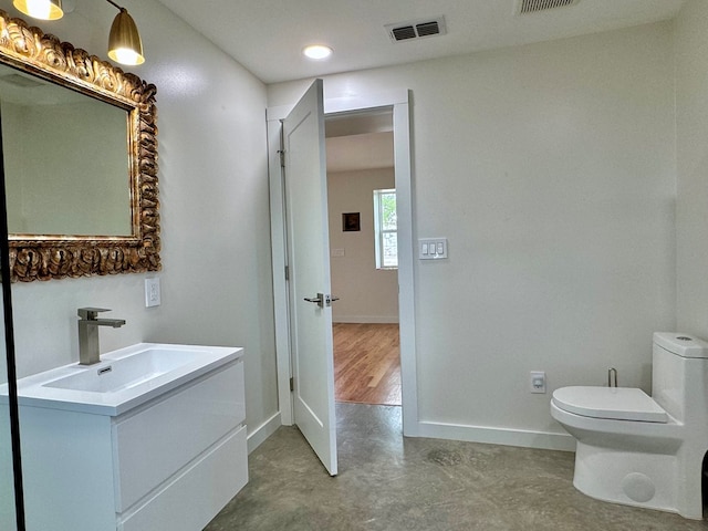 bathroom with vanity and toilet