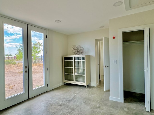 doorway to outside with french doors and a healthy amount of sunlight