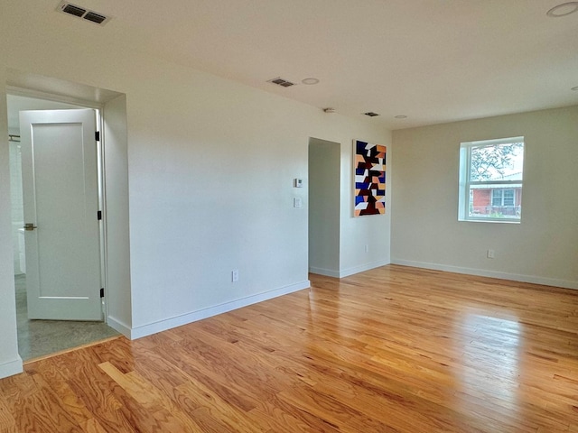 spare room with light hardwood / wood-style floors