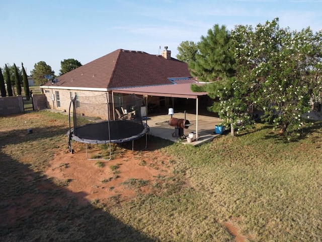 view of yard with a patio area and a trampoline