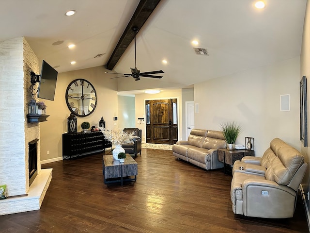 living room featuring lofted ceiling with beams, ceiling fan, dark wood-type flooring, and a fireplace