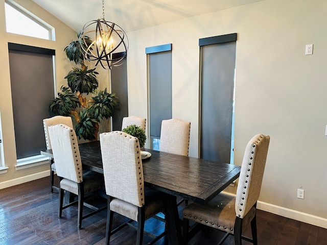 dining area with lofted ceiling, dark hardwood / wood-style flooring, and a chandelier