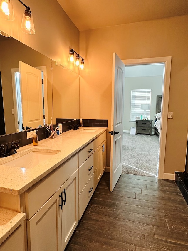 bathroom with vanity and hardwood / wood-style flooring