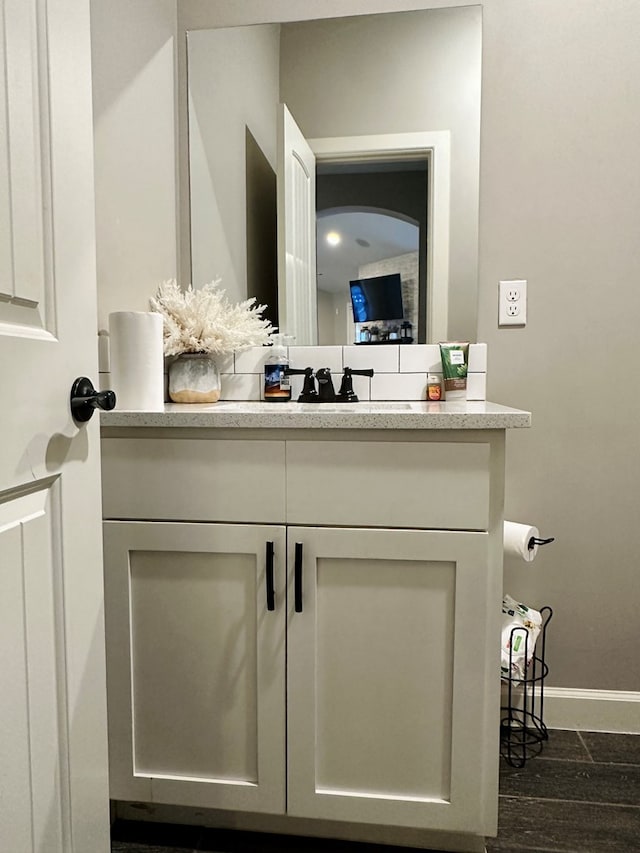 bathroom featuring vanity and hardwood / wood-style floors