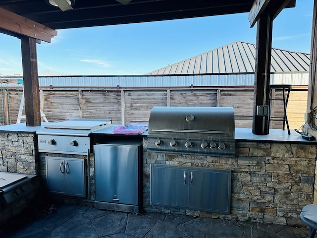 view of patio / terrace with an outdoor kitchen and grilling area