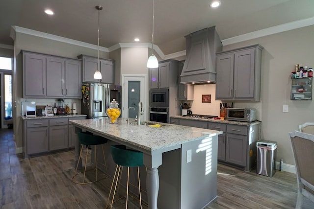 kitchen with gray cabinets, stainless steel appliances, and premium range hood