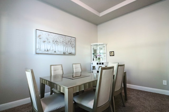 dining space with baseboards and carpet floors