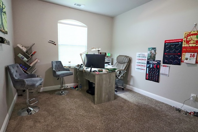 office with visible vents, baseboards, and carpet flooring