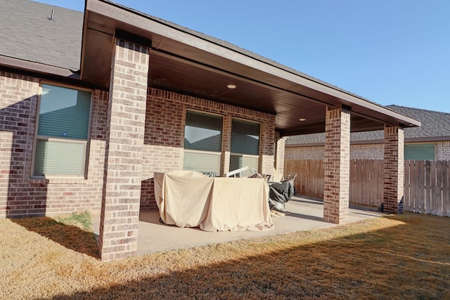 view of patio featuring fence