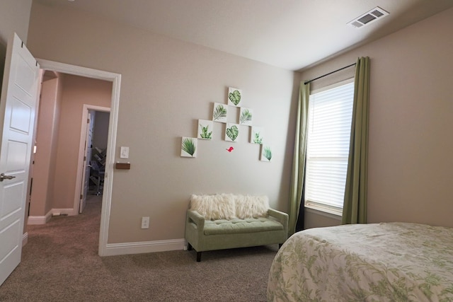 bedroom with visible vents, baseboards, and carpet