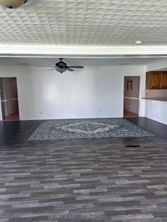 unfurnished living room featuring dark wood-type flooring