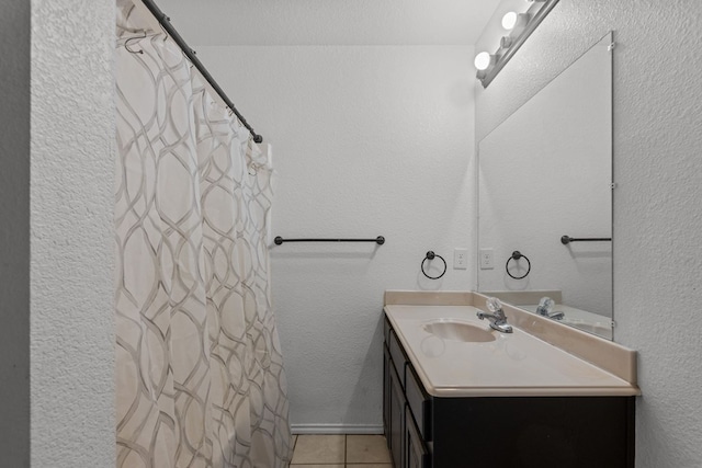 bathroom with vanity and tile patterned flooring