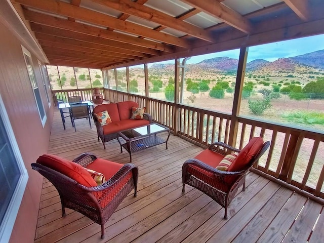 wooden deck with a mountain view