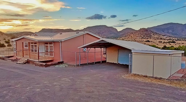 exterior space with a mountain view and a carport