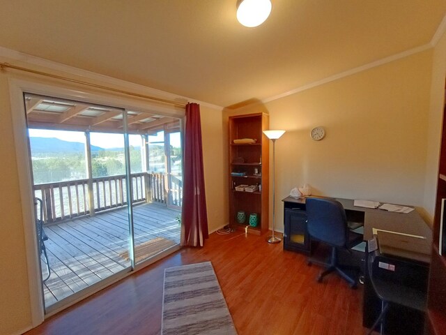 office space featuring hardwood / wood-style flooring and crown molding