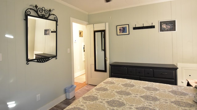 bedroom featuring light wood-type flooring and ornamental molding