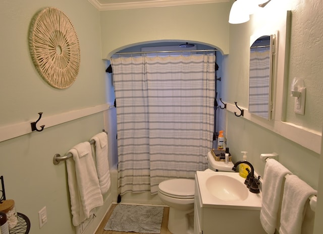 full bathroom with vanity, toilet, shower / bath combo with shower curtain, and crown molding